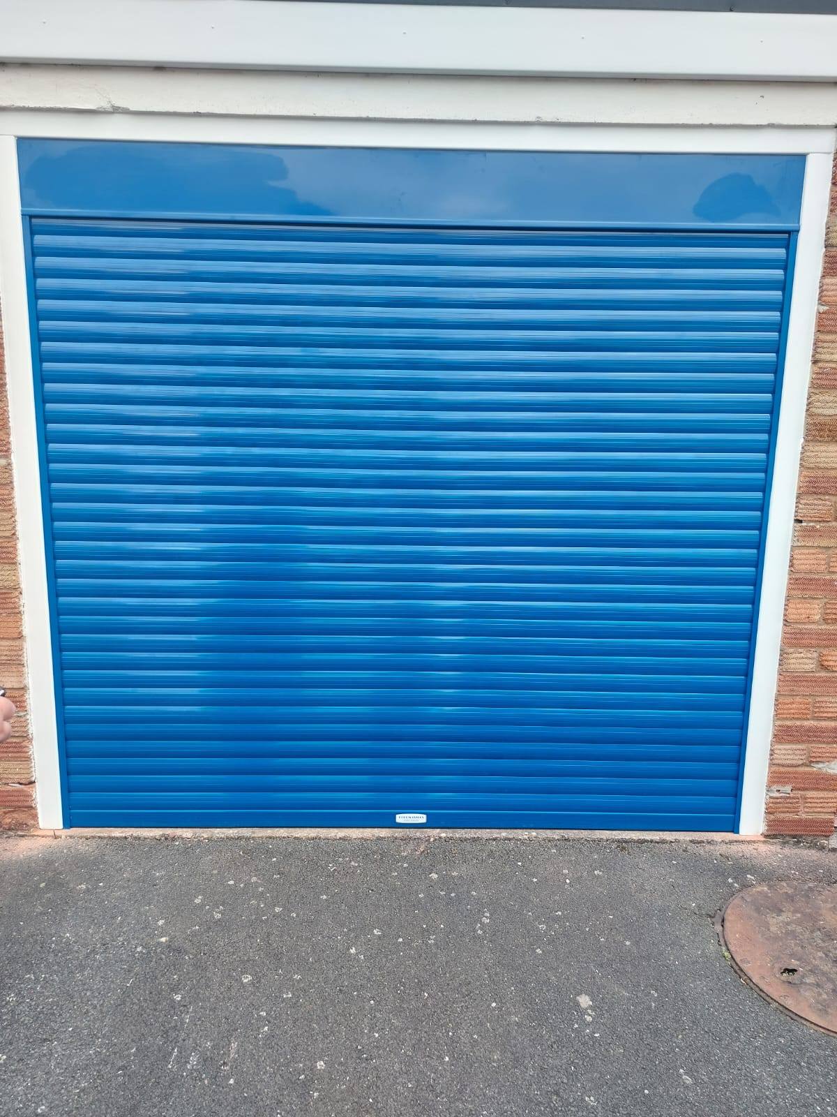 Blue roller garage door in Telford