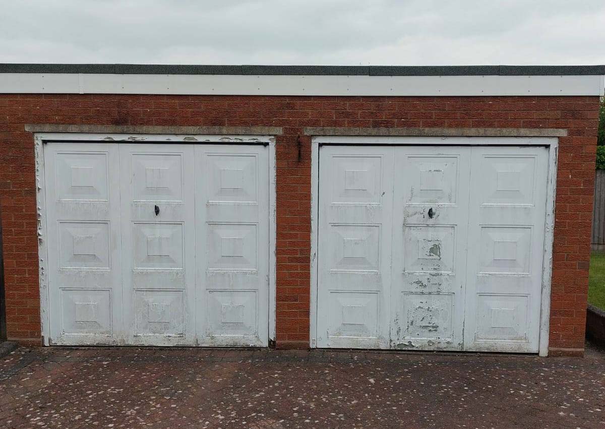 Old garage doors before in Telford